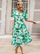 Load image into Gallery viewer, Ruched Printed Surplice Short Sleeve Dress

