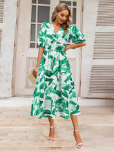 Load image into Gallery viewer, Ruched Printed Surplice Short Sleeve Dress
